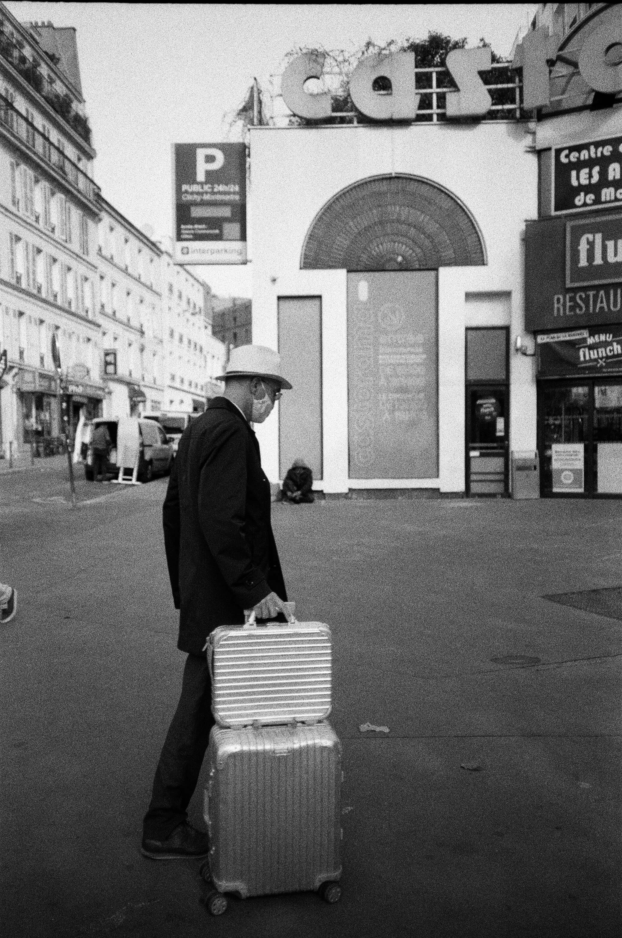 Barthelemy de Mazenod | People of Paris | Man walking with his luggage Place de Clichy