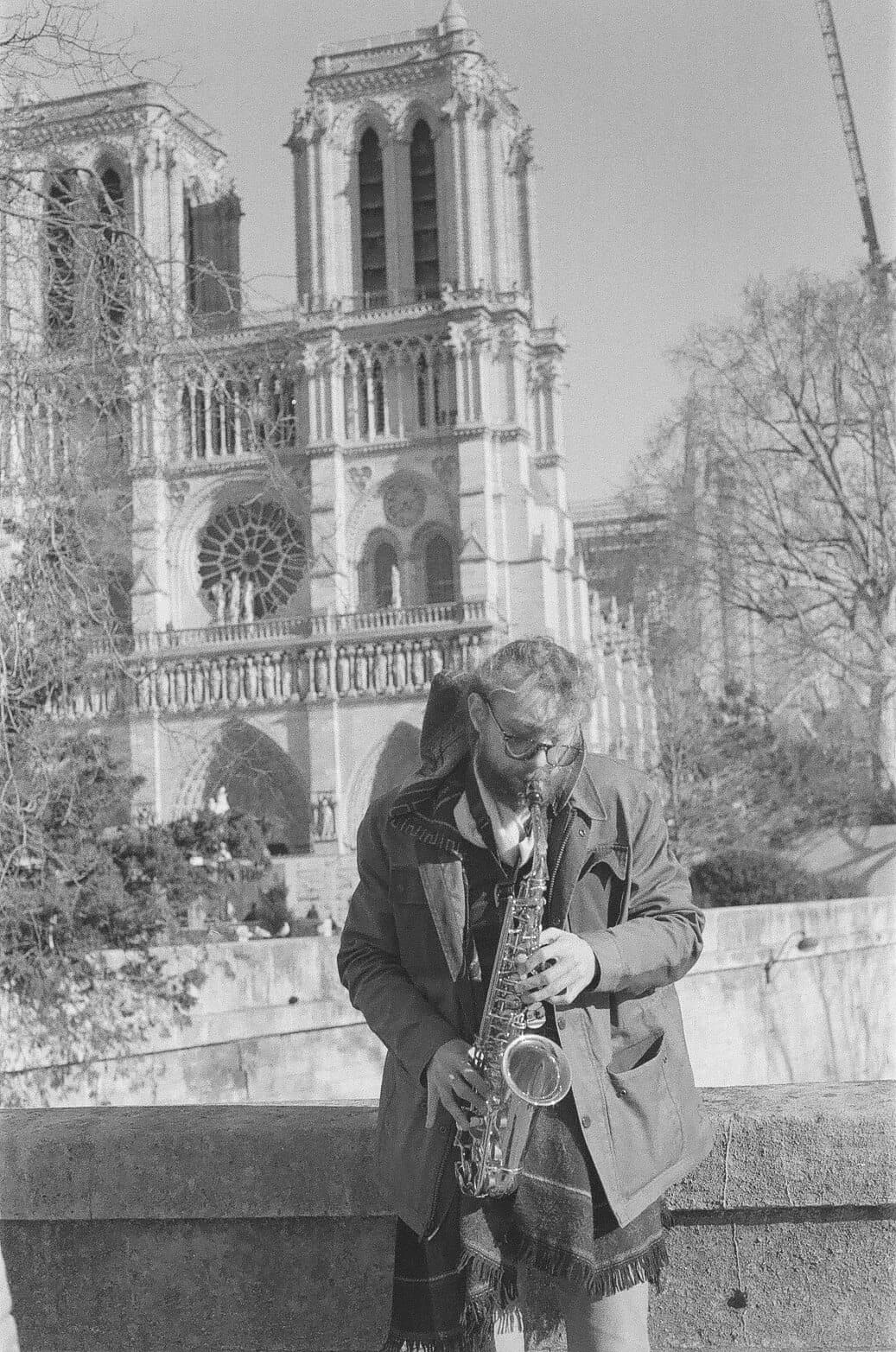 Barthelemy de Mazenod | People of Paris | Man playing the saxophone in front of Notre Dame Cathedral