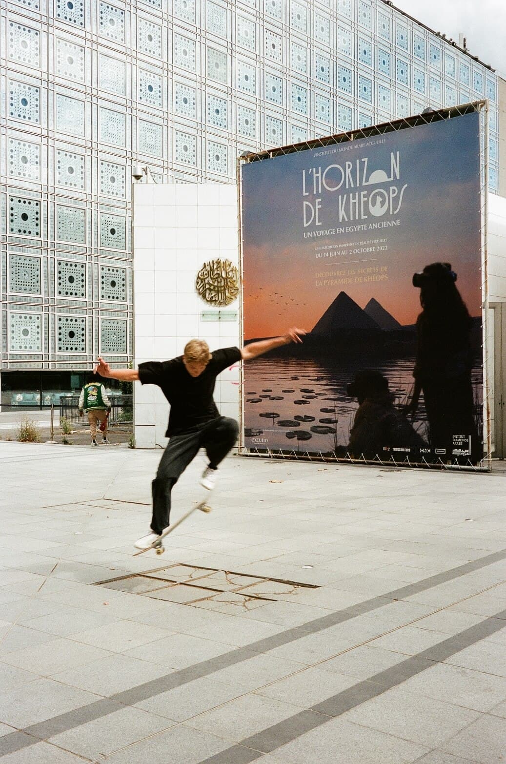 Barthelemy de Mazenod | People of Paris | A man skating over an obstacle in front of the Institut du Monde Arabe
